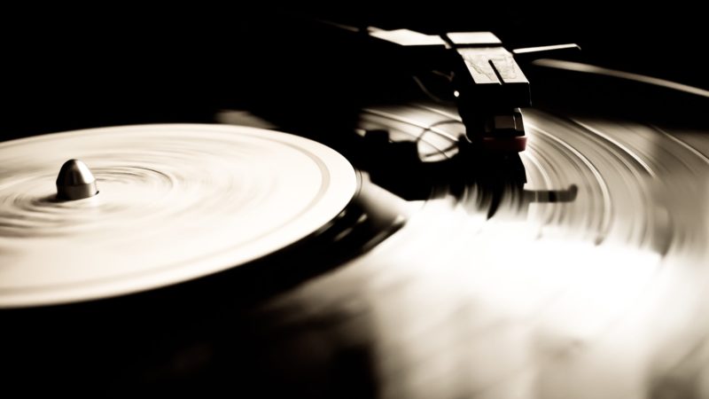 Close-up image of a record playing on a turntable.